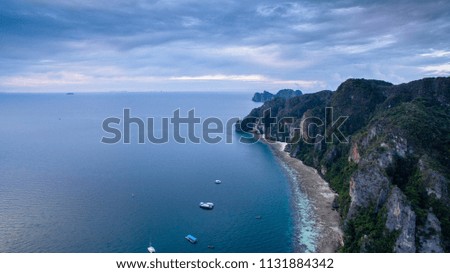 Aerial view of Phi Phi Island, Phuket at sunrise with cloudy sky