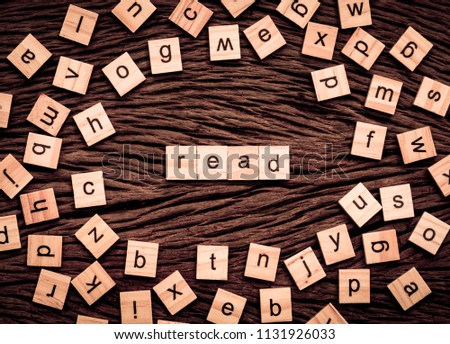 Read word written cube on wooden background. Vintage concept.