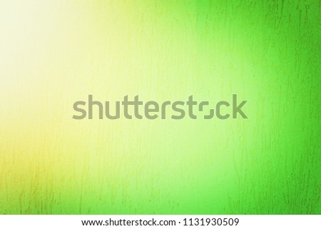 Green painted textured wall background with light 