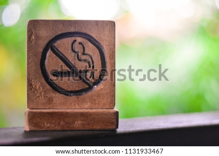 No smoking sign or non smoking area with green nature background. stop smoking and prohibition concept.
