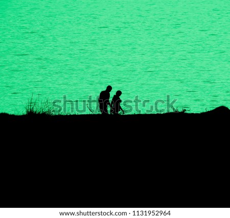 Female and male silhouettes on a green background