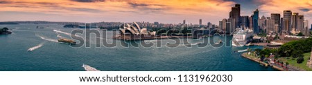Panoramic View of Sydney Skyline with Opera House at Sunset from Harbour Bridge