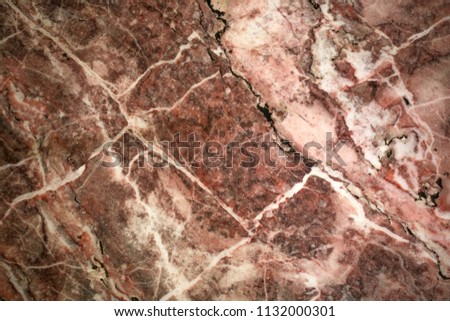 Pink and gray monolithic texture of the old stone (marble) with cracks, scratches, lines, gap, rupture. Abstract pattern . Photo from the historical museum
