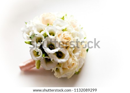 Picture of wedding bouquet on the white windowsill