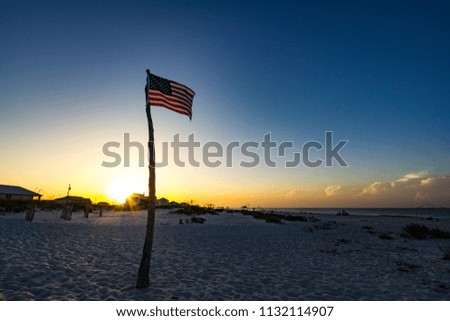 American flag beach sunrise