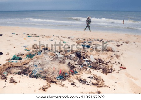 Garbage on a beach, environmental pollution concept picture.