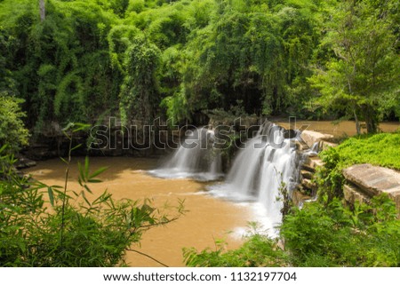 waterfall in green forest mountain