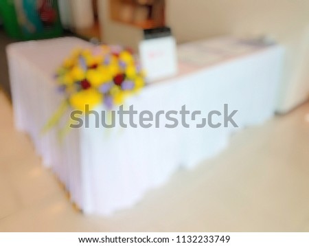 A blurred photo of table for register before join the seminar. Business, seminar, meeting concept.