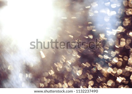Holographic background with multiple colors. Out of focus texture. Holographic wrinkled abstract foil texture with multiple colors. Colorful of bokeh on defocused background. Natural effect.