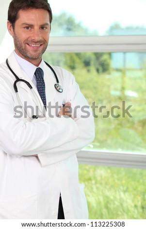 doctor near a window