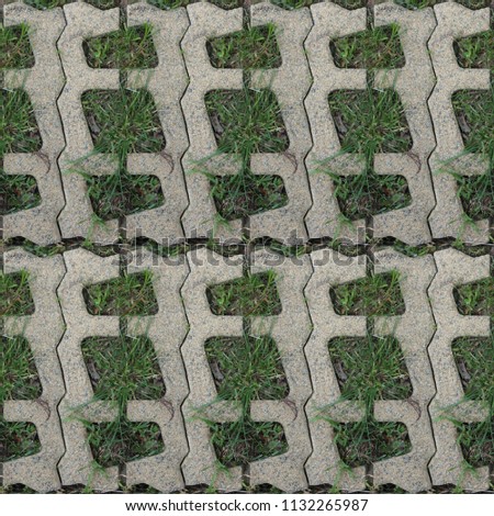 Seamless pattern with stone blocks of the original form on a park path covered and green grass Royalty-Free Stock Photo #1132265987
