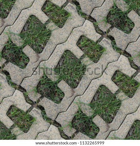Seamless pattern with stone blocks of the original form on a park path covered and green grass Royalty-Free Stock Photo #1132265999