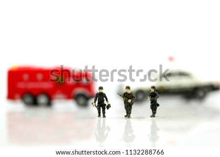 Miniature people : Soldier team with fire engine and police car.