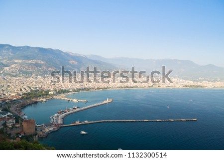 Alanya peninsula, Alanya, Turkey. Tourist ships on the Mediterranean Sea. Port of Alanya. Alanya is a beach resort city and a component district of Antalya Province on the southern coast of Turkey