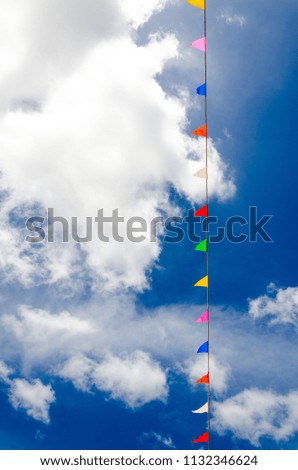 Colorful flags on blue sky used to decorate the ceremony in Buddhism asia thailand