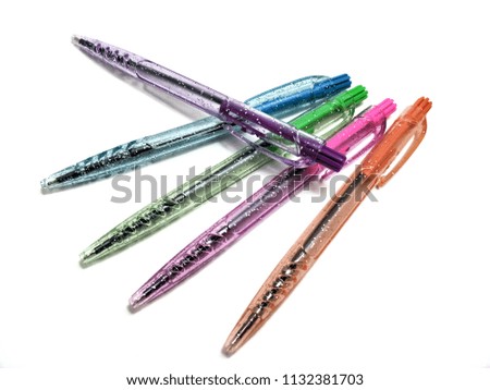 different colorful pens isolated on the white background