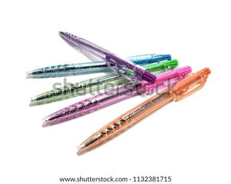 different colorful pens isolated on the white background