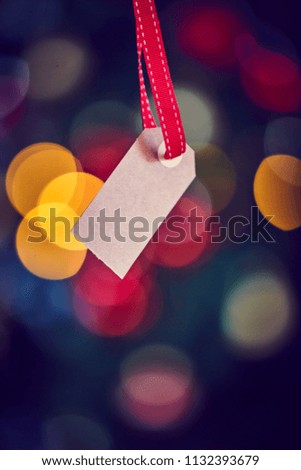 Present Tag mockup with blurry Christmas Light