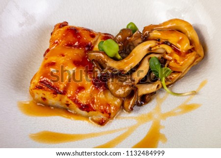 Halibut with mushroom and orange sauce