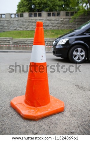 Plastic road cone. Road sign for temporary fencing while carrying out repairs on the road