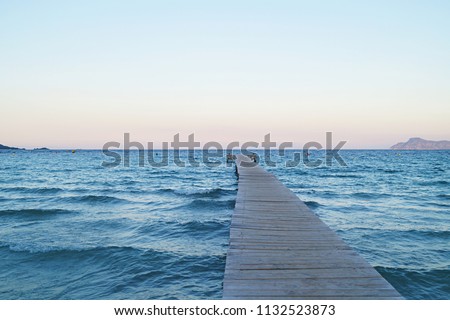 Wooden pier at Puerto de Alcudia, Mallorca island, Spain