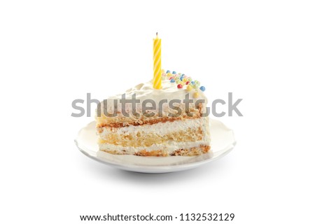 Slice of delicious birthday cake with candle on white background