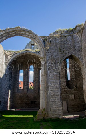 Old historic church ruins with stone vaults and arches against the blue sky in Visby, Gotland in Sweden. Very unique 