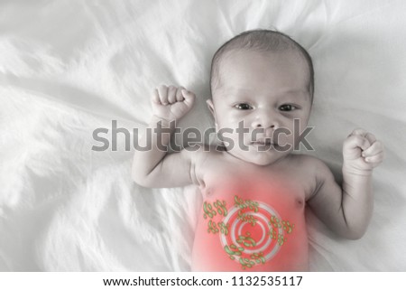 Asian born Little Baby on white cotton.Sick baby, pale picture and Red circle showing sickness
(internal organs)