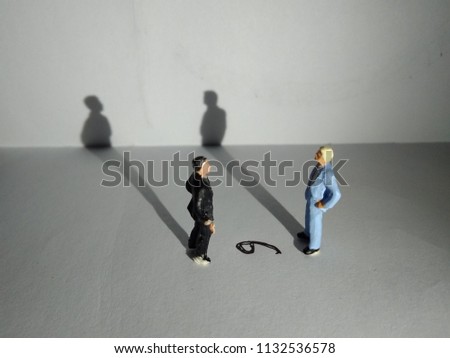 illustration,  different perspective makes another value,  standing businessman mini figure toys facing number six or nine Royalty-Free Stock Photo #1132536578