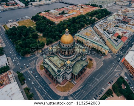 St Petersburg, Russia. View from above of St Isaac`s Square in famous city. Busy streets. Cityscape with green trees. Sightseeing concept