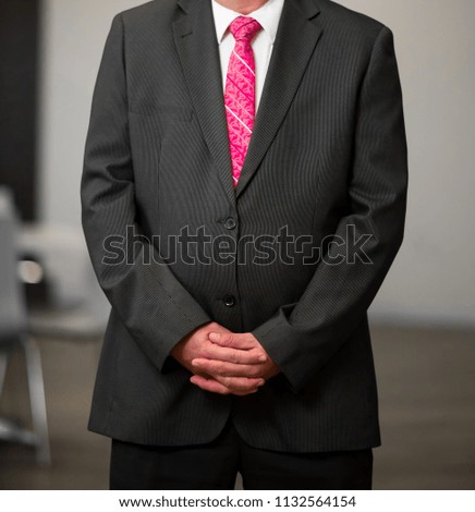 Close up cropped Caucasian hands and arms of businessman in a smart suit