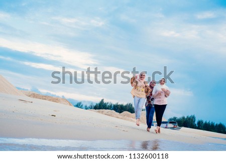 Portrait of three beautiful muslim woman having fun together 