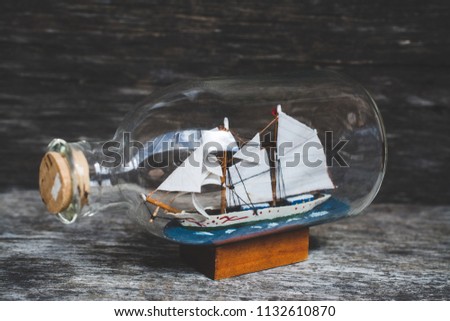 souvenir ship in bottles on the table