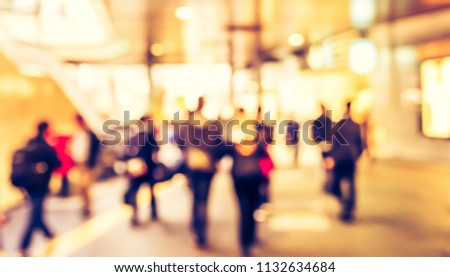 Abstract blur image of Business people walking at  modern hallway with bokeh for background usage . (vintage tone)