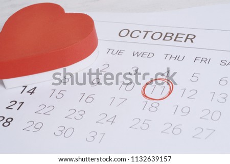 Calendar with gift box heart. Date, love concept.
