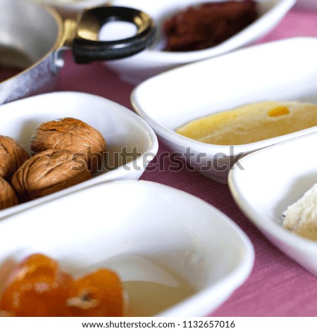 Turkish breakfast. Large walnuts, orange jam and butter