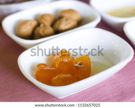 Turkish breakfast. Orange jam in white bowl