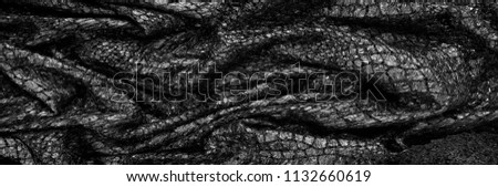 Black fabric Texture background pattern This fabric of silk fabric is ideal for design on backgrounds and computer dГ©cor. Colors include shades of black and charcoal Gold metal accents are everywhere