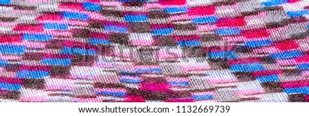 Texture of the background image. Close-up. Multicolored fabric. Macro photography.