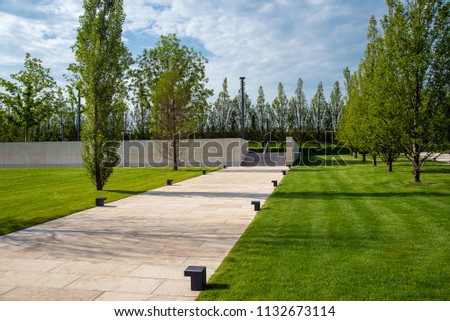 A park, stone paths with sidewalks Royalty-Free Stock Photo #1132673114