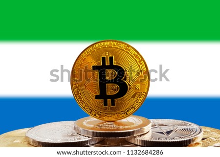 Bitcoin BTC on stack of cryptocurrencies with Sierra Leone flag in background. The cryptocurrency coin is golden and in focus
