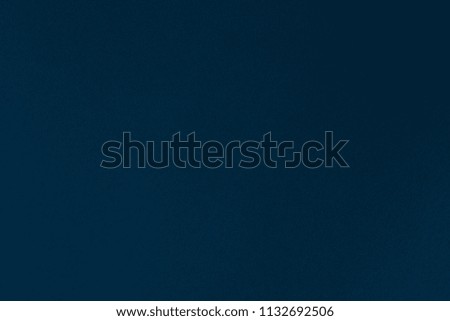 Paper texture dark blue color of the background