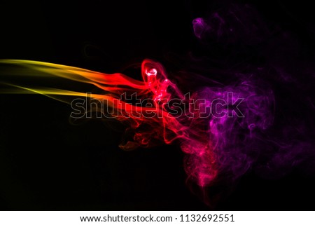 Multicolour smoke on black background