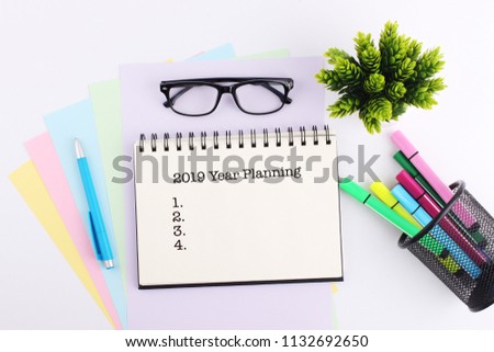 Business concept. Top view notebook writing 2019 year planning