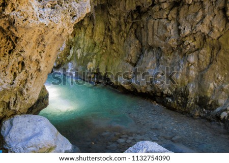 Cave with lake in Greece landscape