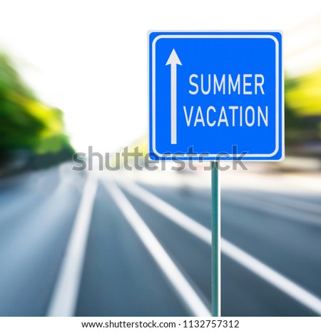Summer vacation motivational phrase on blue road sign with arrow and blurred speedy background. Copy space.