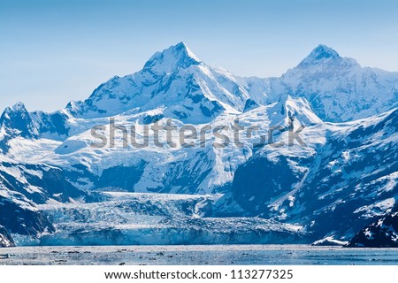 Glacier and snow capped mountains in the Glacier Bay National Park, Alaska Royalty-Free Stock Photo #113277325