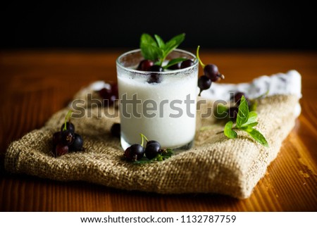 sweet homemade yogurt with black currant in a glass