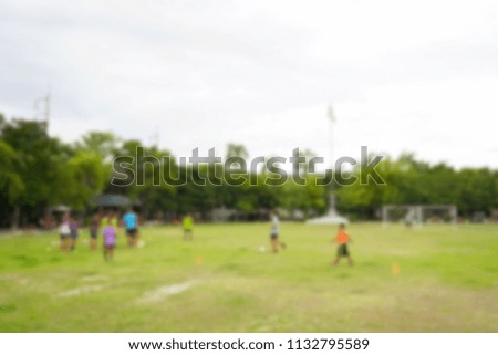 Blurred defocused background Boys on Thai local soccer team practicing, Thai boys in football training with their coach. 