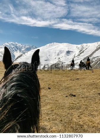 riding a horse first person view of the mountain and sky